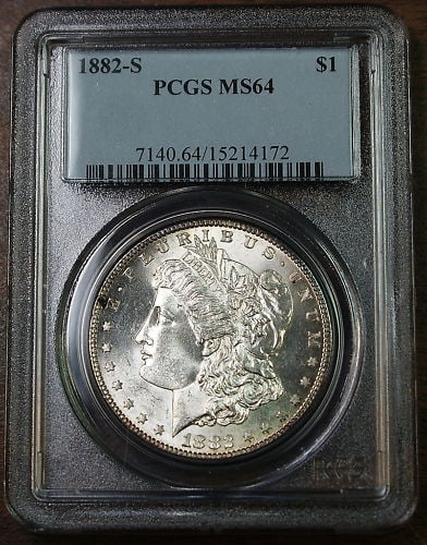 PCGS MS-64 1882-S San Francisco Morgan Silver Dollar: PCGS MS-64 1882-S San Francisco Morgan Silver Dollar This is an 1882-S Morgan Silver Dollar from the San Francisco Mint, graded MS-64 by PCGS. The coin is uncirculated and composed of silver, with a $