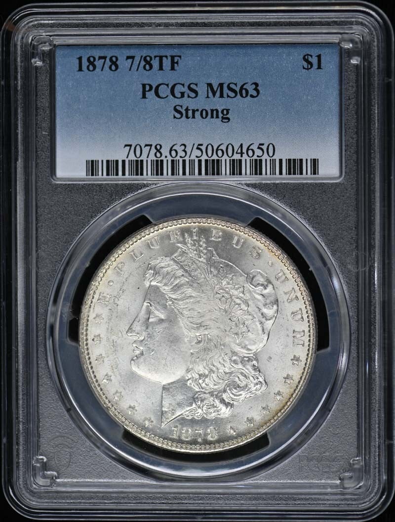 1878 Uncirculated Morgan Dollar PCGS MS63 Philadelphia: 1878 Uncirculated Morgan Dollar PCGS MS63 Philadelphia This 1878 Morgan Dollar is a striking example of American coinage, graded MS63 by PCGS, indicating it is in uncirculated condition. Minted in Phi