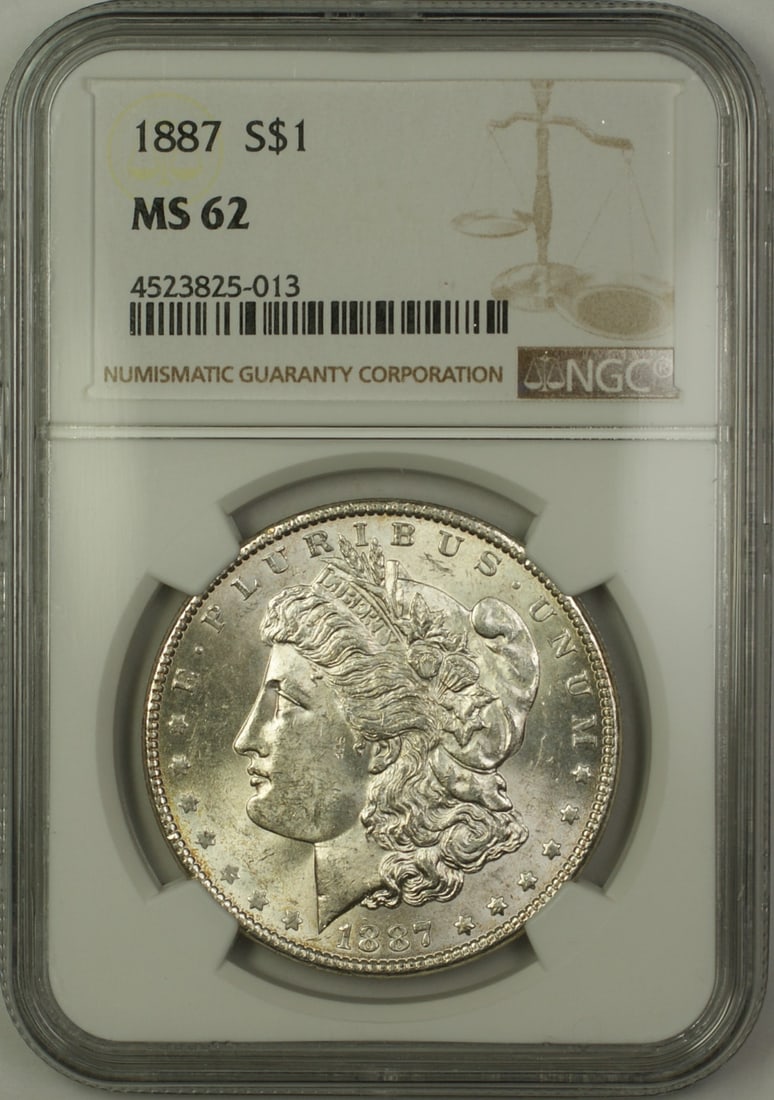 NGC MS 62 Graded 1887 Morgan Silver Dollar Philadelphia Mint: NGC MS 62 Graded 1887 Morgan Silver Dollar Philadelphia Mint This 1887 Morgan Silver Dollar from the Philadelphia Mint is certified by NGC with an MS 62 grade. Composed of silver, this uncirculated co