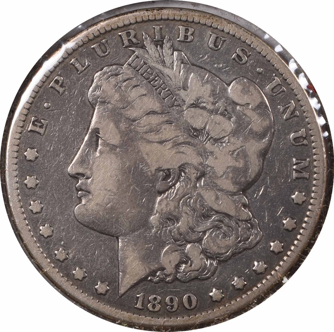 1890 Carson City Morgan Dollar Tail Bar Variety Uncertified Silver Coin: 1890 Carson City Morgan Dollar Tail Bar Variety Uncertified Silver Coin This 1890-CC Morgan Silver Dollar features the distinctive 'Tail Bar' variety and was minted at Carson City. Composed of 90% sil