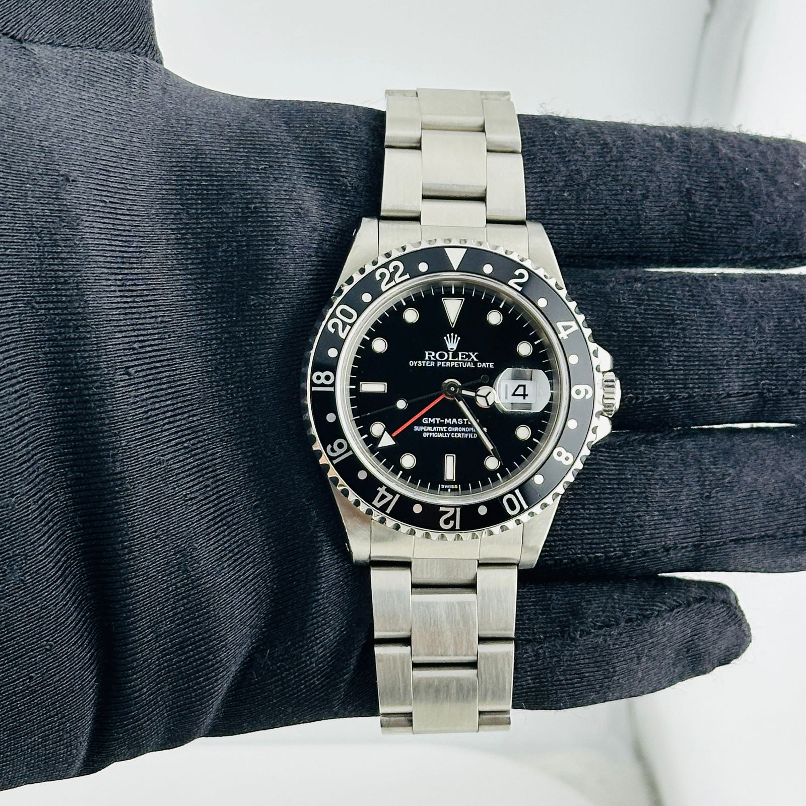 GMT-Master Ref 16700 Black Dial Oyster Bracelet Watch with Papers 2000: GMT-Master Ref 16700 Black Dial Oyster Bracelet Watch with Papers 2000 This Rolex GMT-Master is a men's watch featuring a black dial and black bezel, paired with an Oyster bracelet. The watch is ident
