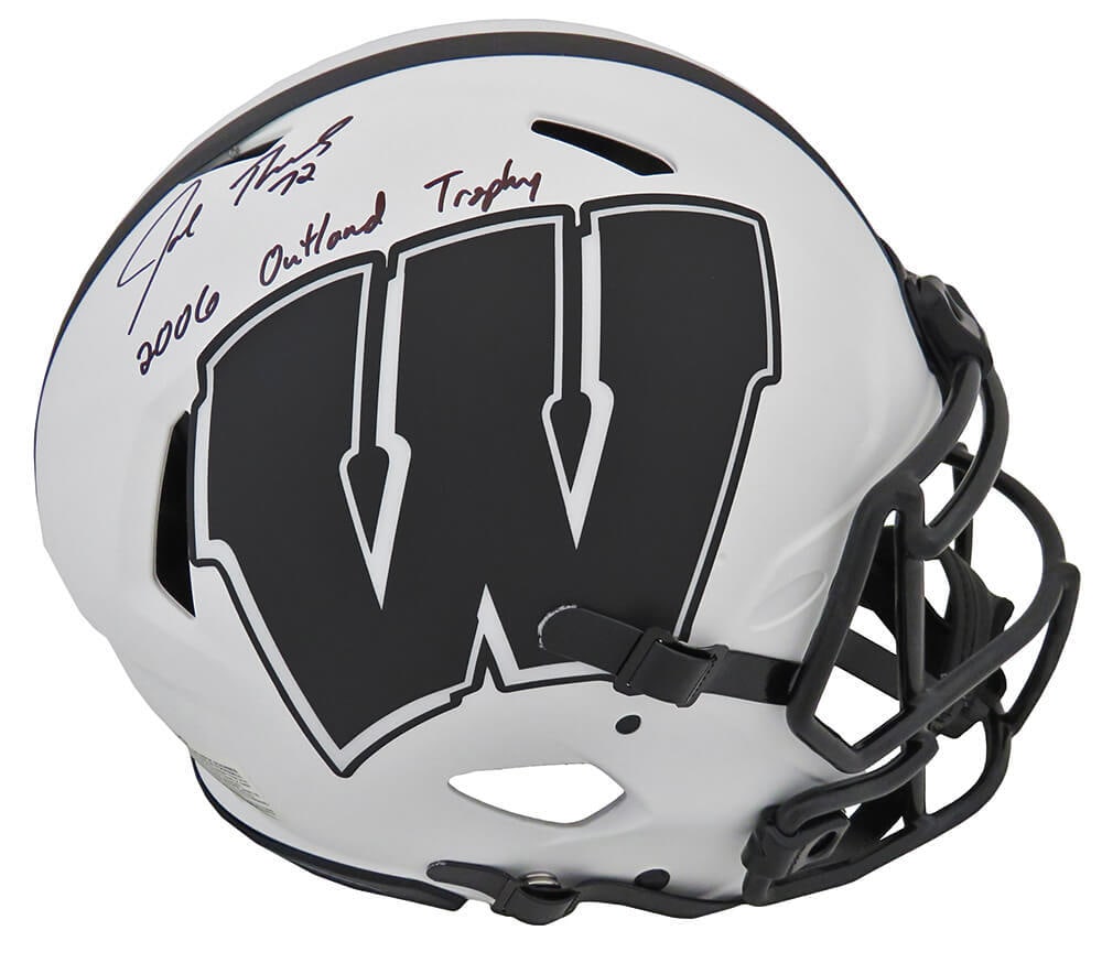 Joe Thomas Signed Wisconsin Badgers Lunar Eclipse Helmet with 2006 Outland Inscription: Joe Thomas Signed Wisconsin Badgers Lunar Eclipse Helmet with 2006 Outland Inscription This authentic Riddell proline speed full-size helmet features a striking Lunar Eclipse white matte finish and is