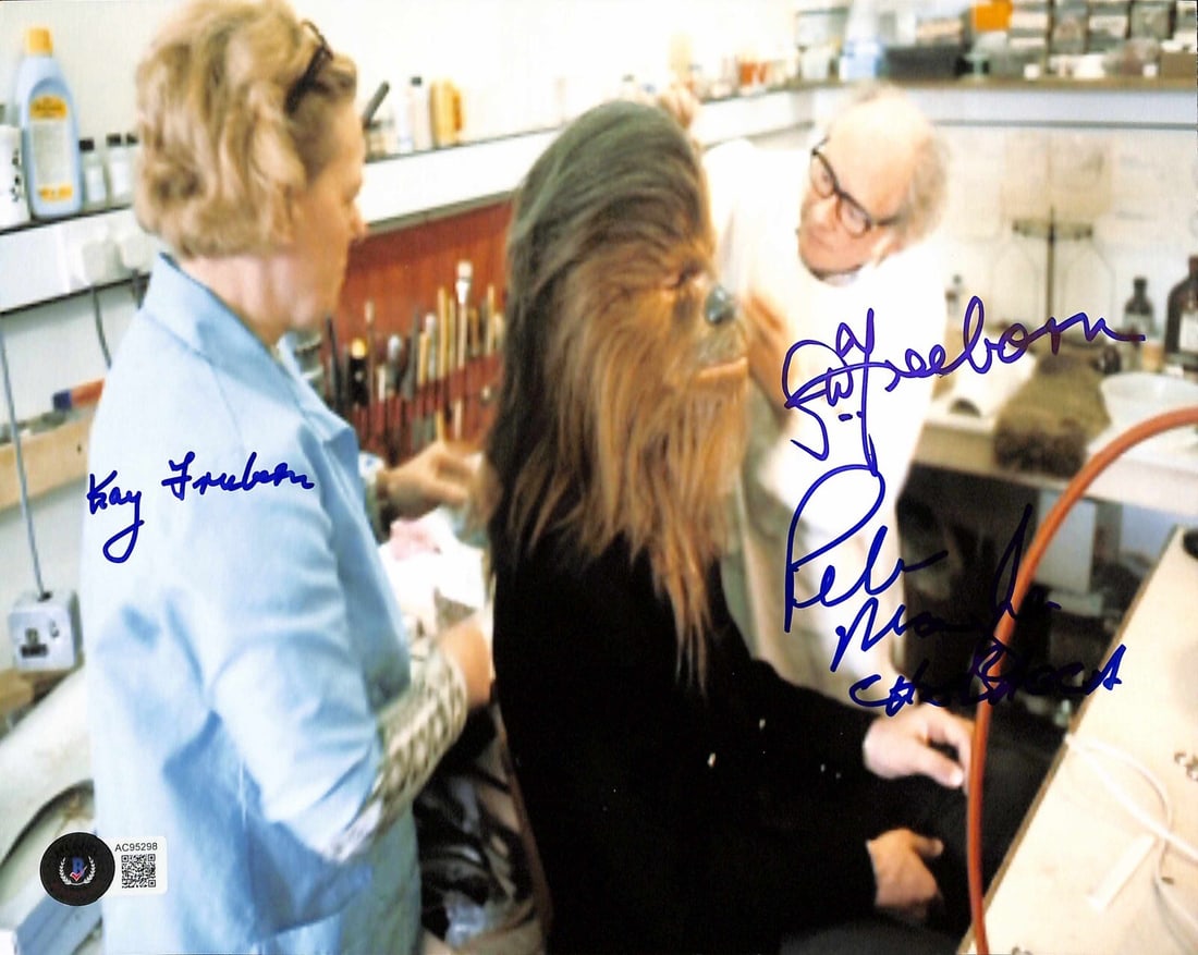 Star Wars 8x10 Photograph Signed by Mayhew and Freeborns Beckett LOA: Star Wars 8x10 Photograph Signed by Mayhew and Freeborns Beckett LOA This is an original 8x10 photograph signed by Peter Mayhew, Stuart Freeborn, and Kay Freeborn. The autographs were obtained in pers