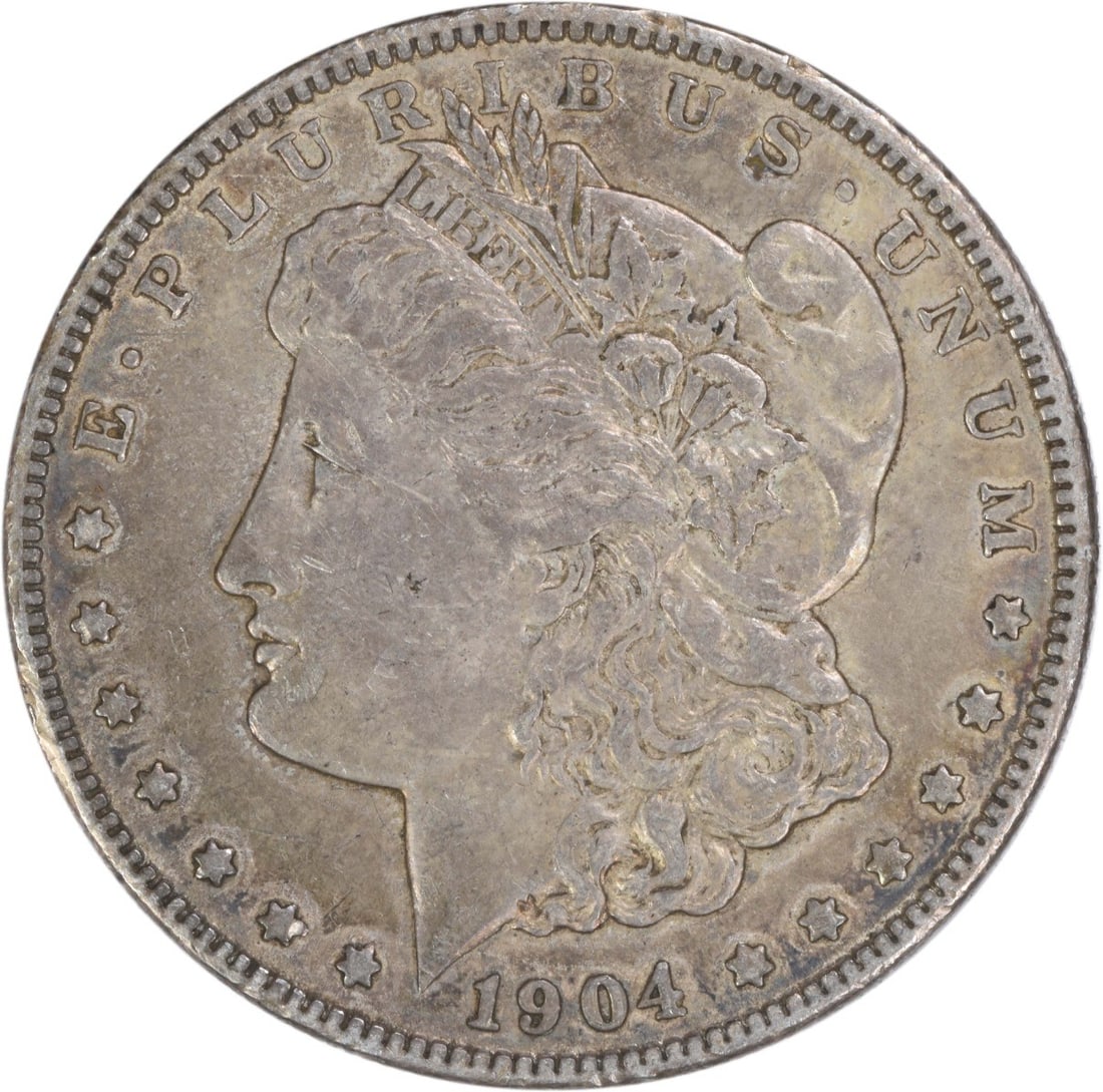 1904 Philadelphia Morgan Dollar 90 Percent Silver EF Grade Uncertified: 1904 Philadelphia Morgan Dollar 90 Percent Silver EF Grade Uncertified This 1904 Morgan Silver Dollar was struck at the Philadelphia Mint and features a composition of 90% silver and 10% copper. Desig