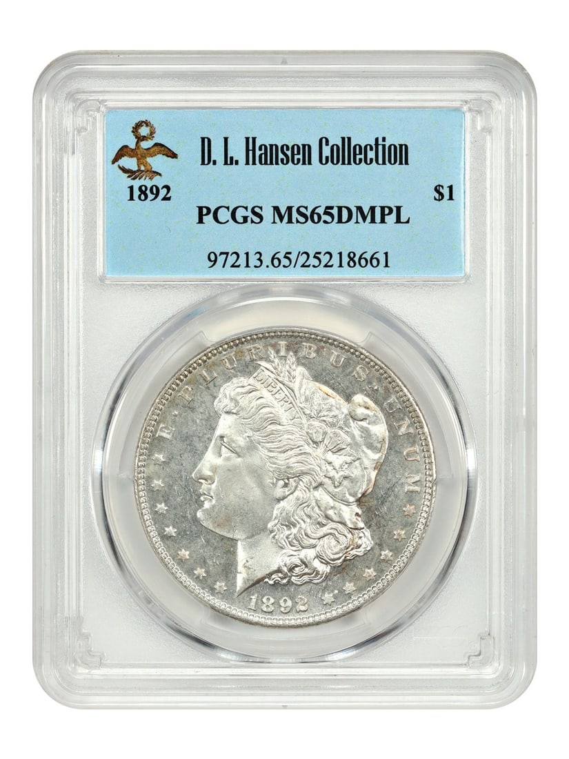 PCGS MS65DMPL 1892 Morgan Dollar ex D L Hansen Tied Finest Deep Mirror Prooflike: PCGS MS65DMPL 1892 Morgan Dollar ex D L Hansen Tied Finest Deep Mirror Prooflike This is a rare 1892 Morgan Dollar graded MS65DMPL by PCGS and originating from the D.L. Hansen collection. Certified as