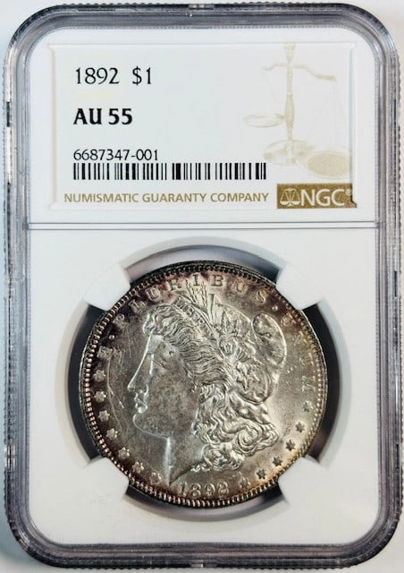 NGC Certified 1892 Silver Dollar Graded AU 55: NGC Certified 1892 Silver Dollar Graded AU 55 This 1892 Morgan Silver Dollar has been certified by NGC with a grade of AU-55, indicating it is in About Uncirculated condition. Minted in the United Sta