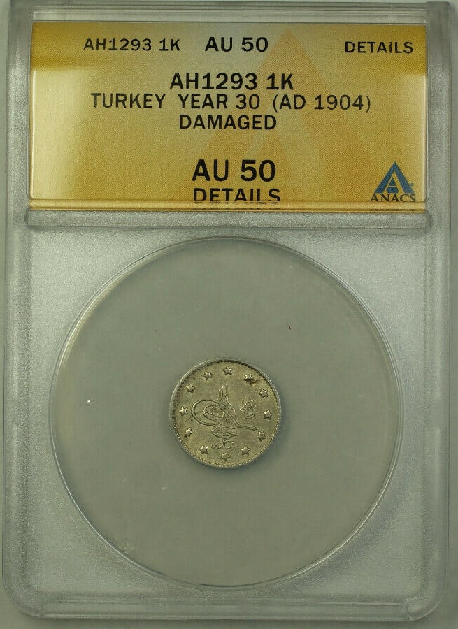 Turkey 1904 Silver 1 Kurus ANACS AU 50 Damaged KM 735 Year 30 AH1293: Turkey 1904 Silver 1 Kurus ANACS AU 50 Damaged KM 735 Year 30 AH1293 This 1904 Turkey 1 Kurus coin, year 30 (AH1293), is composed of 0.83 fine silver. It has been graded by ANACS as AU 50 Detail and n