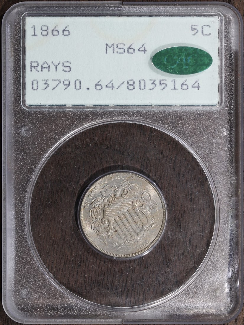 PCGS MS64 CAC 1866 Shield Nickel Five Cent With Rays Rattler Holder: PCGS MS64 CAC 1866 Shield Nickel Five Cent With Rays Rattler Holder This 1866 Shield Nickel is graded MS64 by PCGS and features the 'With Rays' variety. The coin is composed of copper, is uncirculated