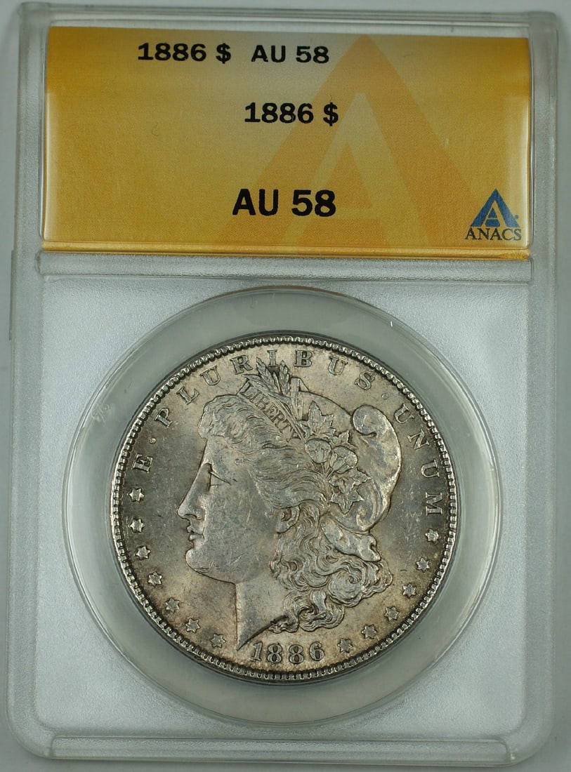 ANACS AU 58 1886 Philadelphia Morgan Silver Dollar US Coin: ANACS AU 58 1886 Philadelphia Morgan Silver Dollar US Coin This is an 1886 Morgan Silver Dollar coin graded AU-58 by ANACS. Struck at the Philadelphia Mint, this circulated coin is composed of silver