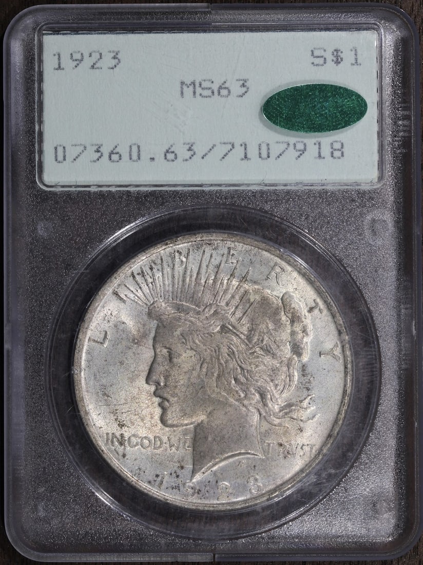 1923 Peace Silver Dollar MS63 CAC PCGS Rattler Old Holder: 1923 Peace Silver Dollar MS63 CAC PCGS Rattler Old Holder This 1923 Peace Silver Dollar is a stunning piece of numismatic history, showcasing uncirculated quality with a grade of MS 63 from PCGS. The