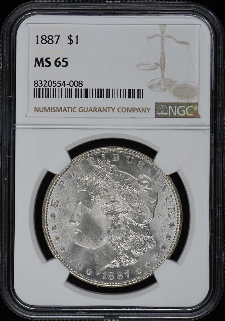 1887 Morgan Dollar NGC MS65 Uncirculated Coin: 1887 Morgan Dollar NGC MS65 Uncirculated Coin This stunning 1887 Morgan Dollar showcases the artistry of American coinage. Certified by NGC with a prestigious grade of MS65, this uncirculated coin has