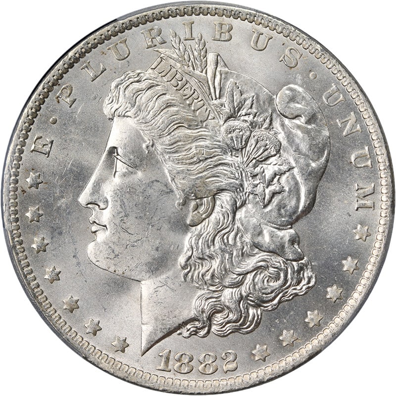 PCGS MS63 1882-O Morgan Dollar Silver Coin with Strong Luster: PCGS MS63 1882-O Morgan Dollar Silver Coin with Strong Luster This original 1882-O Morgan Silver Dollar is certified by PCGS with a grade of MS63. The coin is uncirculated, features excellent eye appe