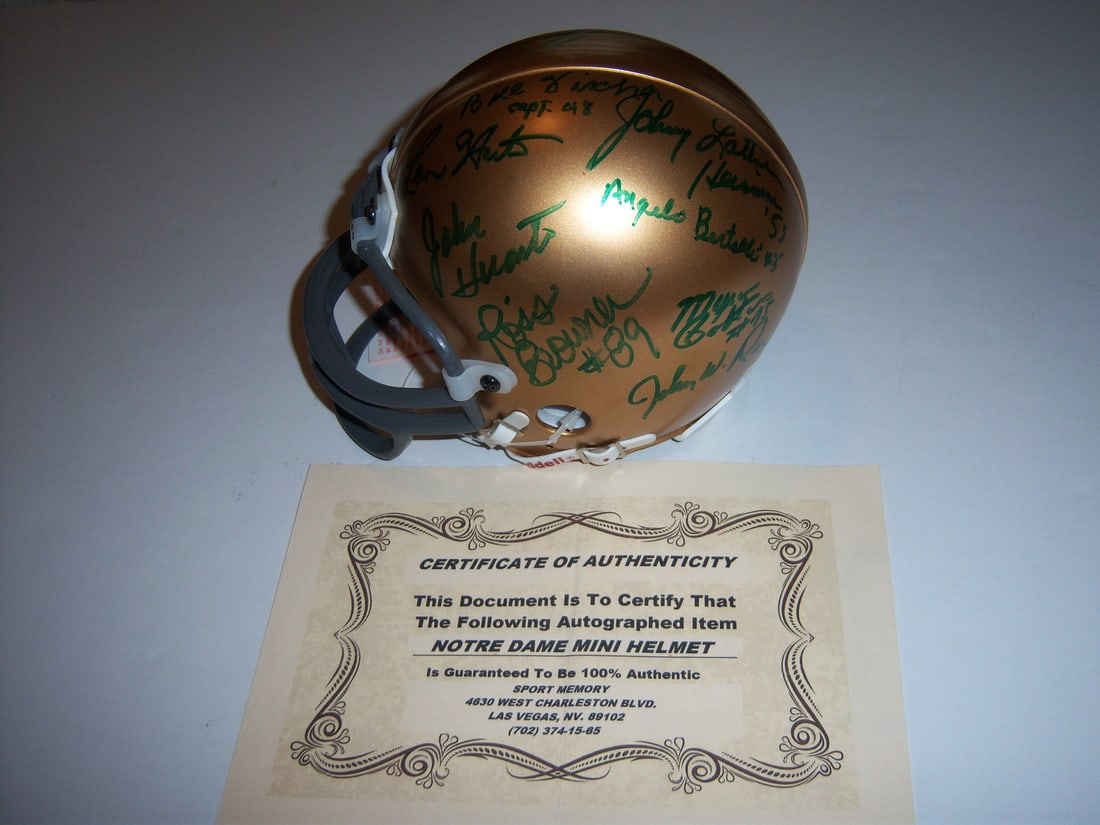 Signed Mini Football Helmet with 8 Autographs and COA (1 of 2)
