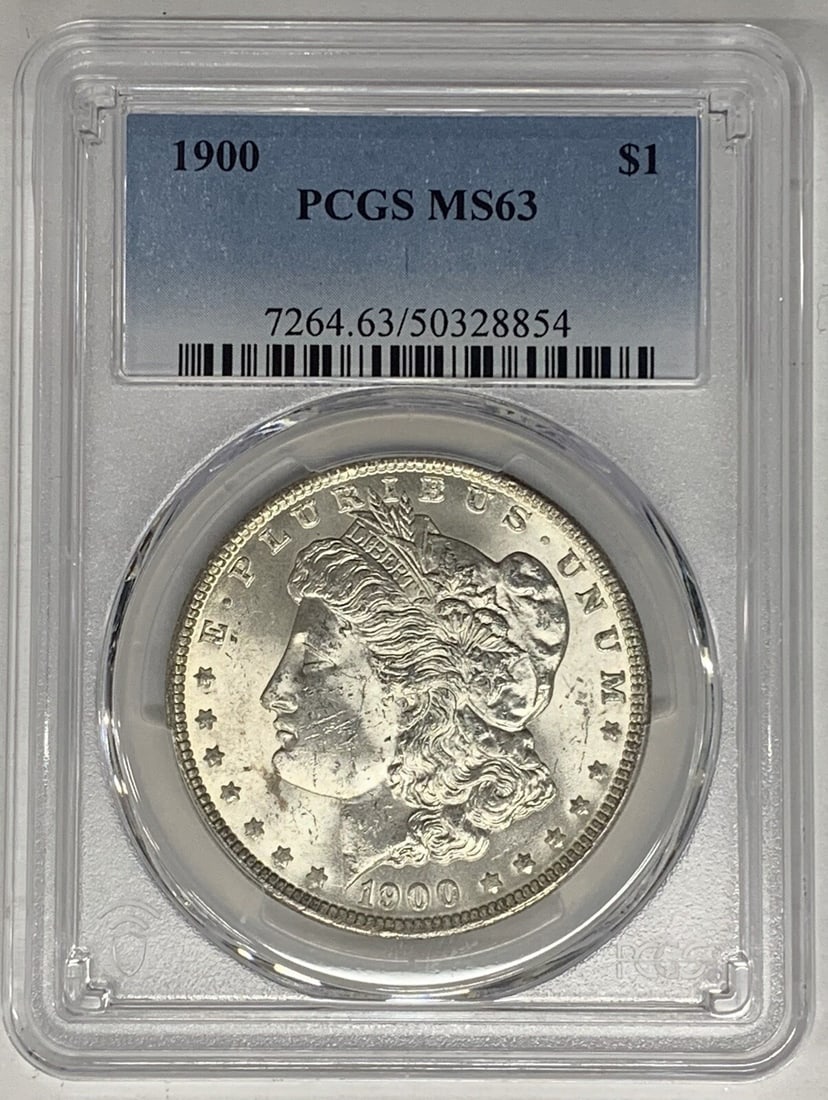 PCGS MS 63 Graded 1900 Silver Morgan Dollar Uncirculated Coin: PCGS MS 63 Graded 1900 Silver Morgan Dollar Uncirculated Coin This is a 1900 Morgan Silver Dollar coin from the United States, composed of silver and graded MS 63 by PCGS. The coin is uncirculated and