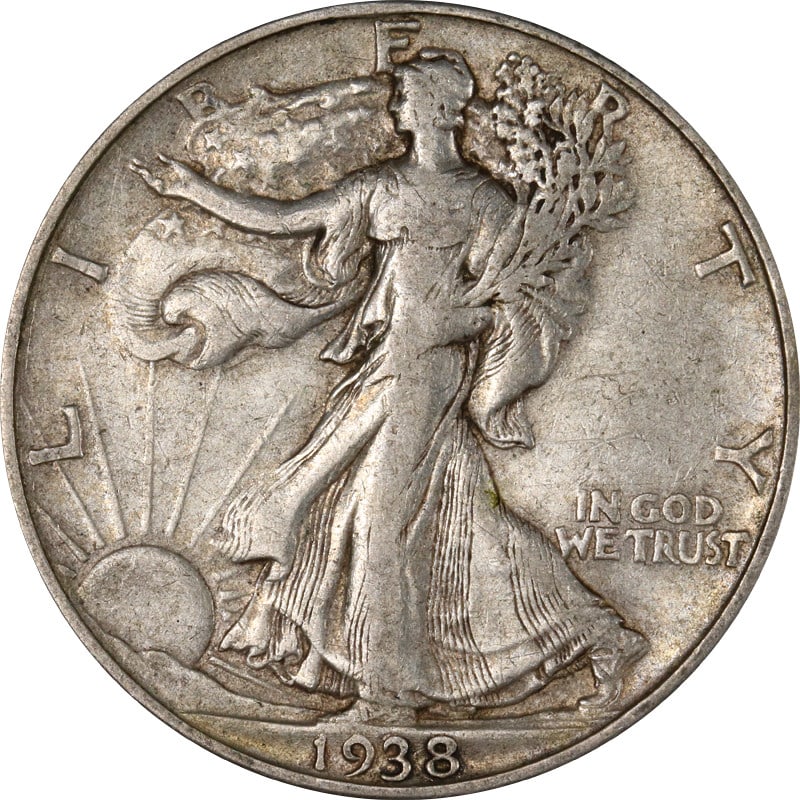 1938-D Walking Liberty Half Silver Coin Circulated Denver Mint: 1938-D Walking Liberty Half Silver Coin Circulated Denver Mint This 1938-D Walking Liberty Half is a distinguished piece of American numismatic history. It features a beautifully detailed design that
