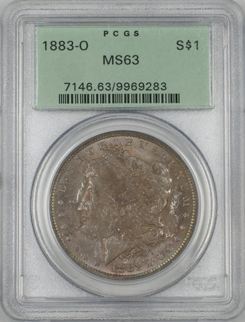 PCGS MS63 1883-O Morgan Silver Dollar Proof-Like Toned Old Green Holder: PCGS MS63 1883-O Morgan Silver Dollar Proof-Like Toned Old Green Holder This 1883-O Morgan Silver Dollar is graded MS-63 by PCGS and comes in the old green holder. The coin is from the New Orleans Min