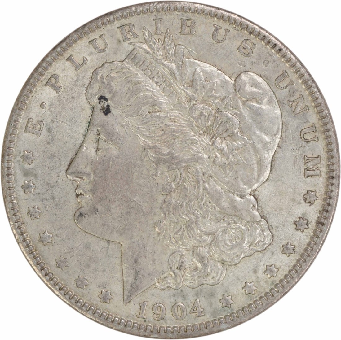 1904 Morgan Silver Dollar EF Uncertified 90% Silver Coin: 1904 Morgan Silver Dollar EF Uncertified 90% Silver Coin This 1904 Morgan Silver Dollar is a classic piece of American numismatics, featuring a design by George T. Morgan. The coin is composed of 90%
