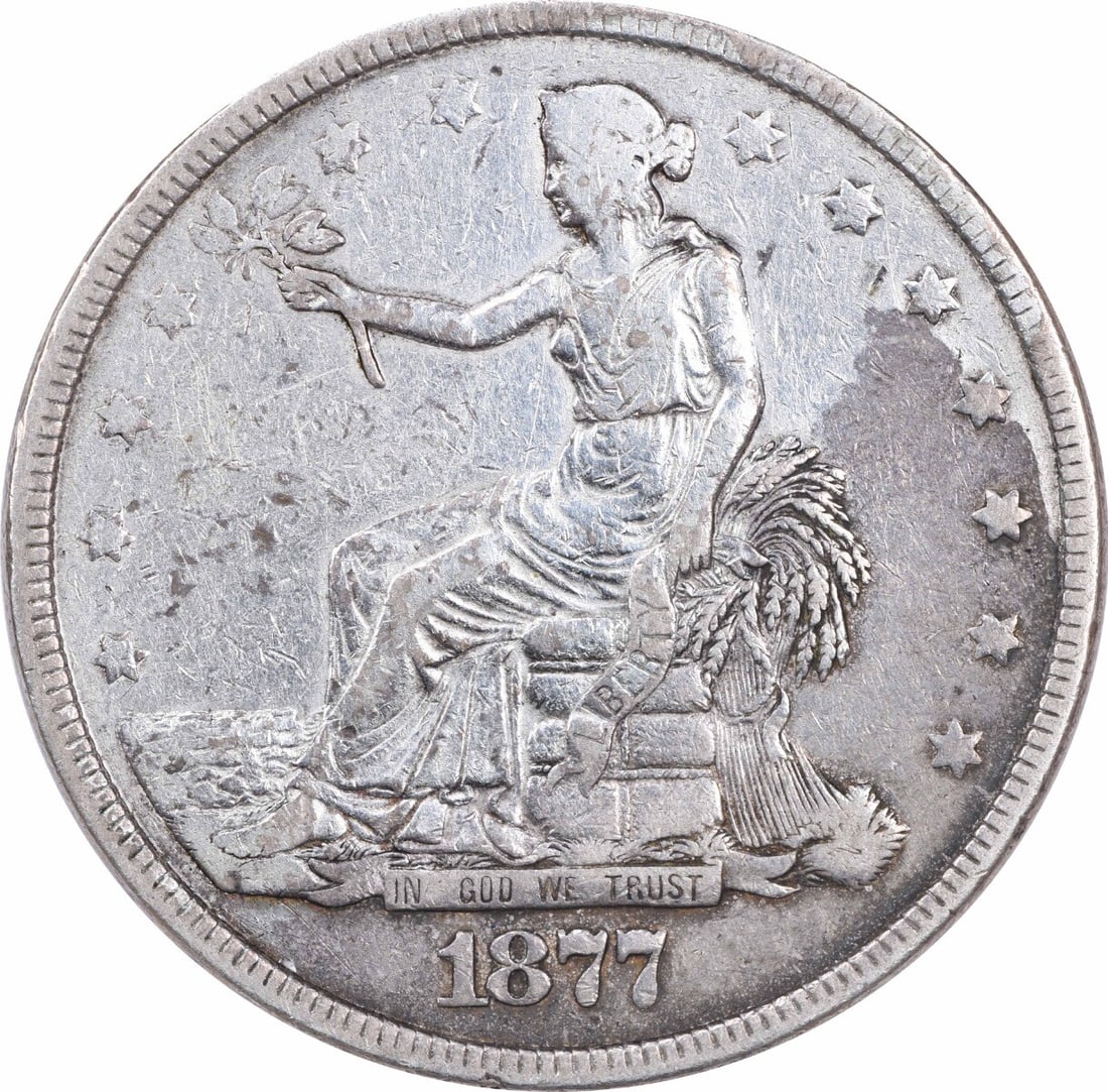 1877 Trade Silver Dollar VF Uncertified 90% Silver Barber Design: 1877 Trade Silver Dollar VF Uncertified 90% Silver Barber Design This 1877 Trade Silver Dollar presents a beautiful example of American coinage with a vintage appeal. Crafted in Philadelphia, this coi