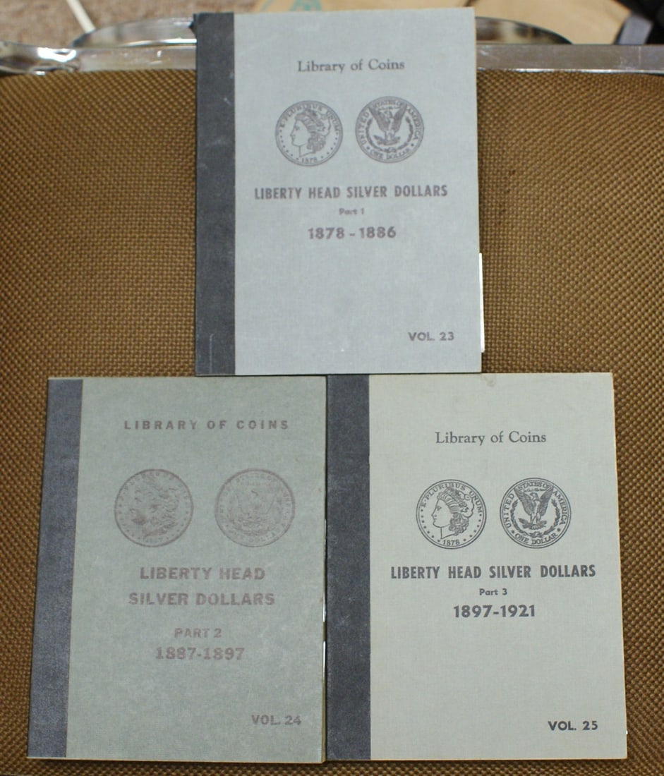 Empty Liberty Head Silver Dollar Albums 1887-1921 Parts 1-3 Collection: Empty Liberty Head Silver Dollar Albums 1887-1921 Parts 1-3 Collection This is a set of Library of Coins Liberty Head Silver Dollars albums, Part 1-3, covering the years 1887-1921. The albums are empt