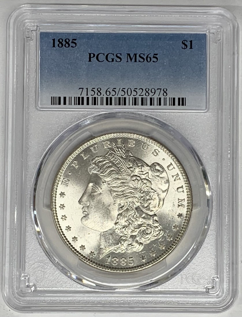 PCGS MS 65 1885 Silver Morgan Dollar Certified Uncirculated $1 Coin: PCGS MS 65 1885 Silver Morgan Dollar Certified Uncirculated $1 Coin This is an 1885 Morgan Silver Dollar from the United States, graded MS 65 by PCGS. The coin is uncirculated and composed of silver.
