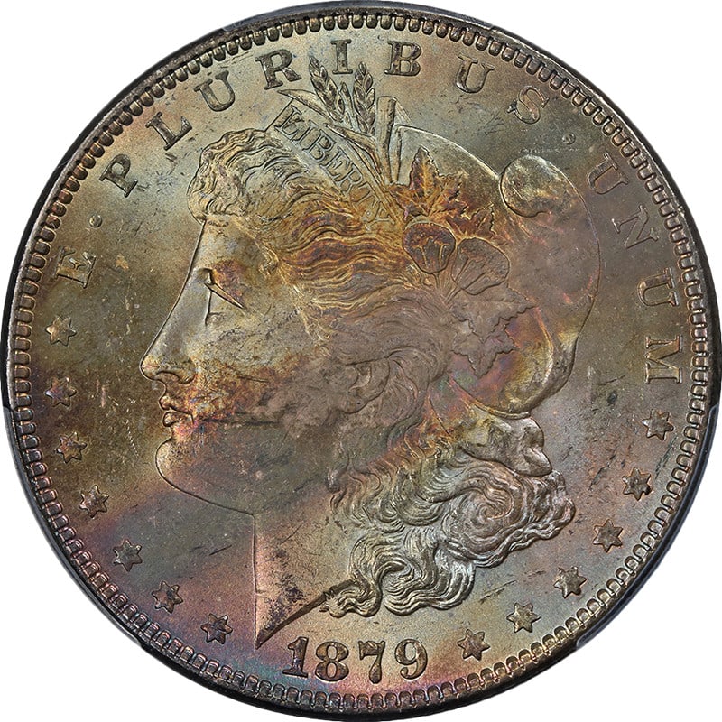 1879-P Morgan Silver Dollar PCGS MS64 Superb Toning and Eye Appeal: 1879-P Morgan Silver Dollar PCGS MS64 Superb Toning and Eye Appeal This stunning 1879-P Morgan Silver Dollar is graded PCGS MS64, showcasing superb eye appeal with fantastic luster and a strong strike