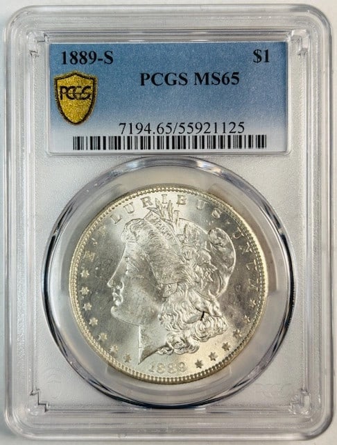 PCGS MS65 1889 San Francisco Morgan Silver Dollar White Uncirculated: PCGS MS65 1889 San Francisco Morgan Silver Dollar White Uncirculated This 1889 S Morgan Silver Dollar is certified by PCGS with a grade of MS 65. Struck at the San Francisco Mint, the coin is composed