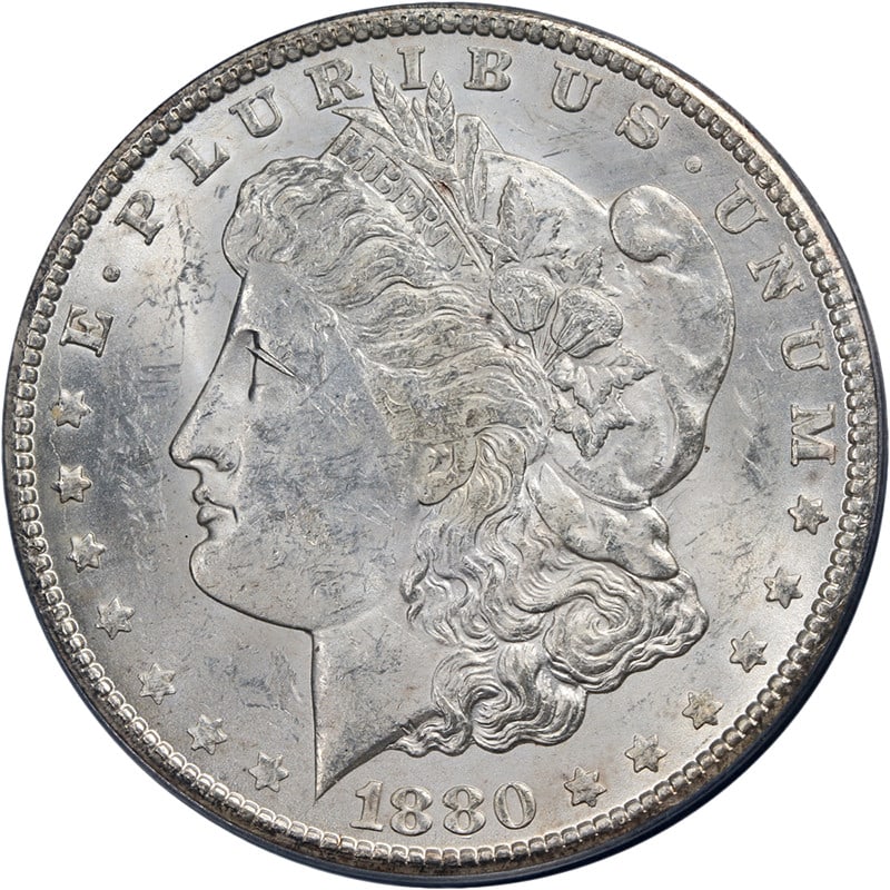 1880-CC Morgan Silver Dollar PCGS MS60 Uncirculated Silver Coin: 1880-CC Morgan Silver Dollar PCGS MS60 Uncirculated Silver Coin This 1880-CC Morgan Silver Dollar is a stunning piece featuring bright white surfaces and appealing luster. Graded MS60 by PCGS, this co