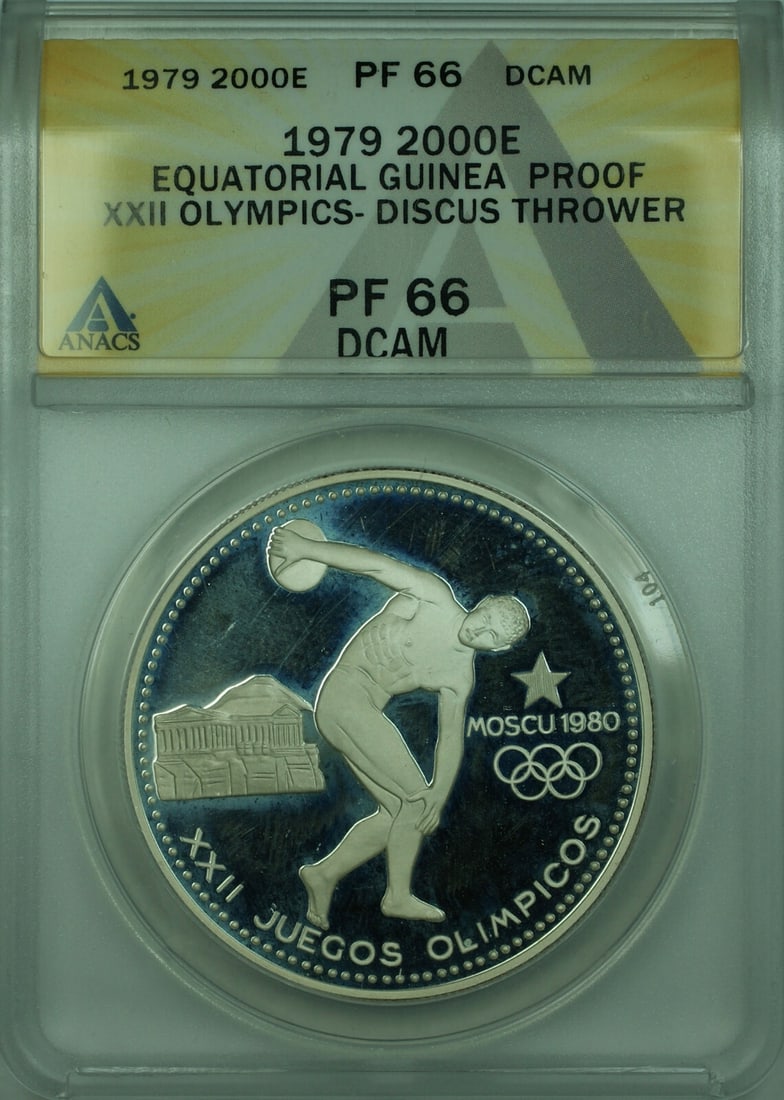 Equatorial Guinea 1979 2000 Ekuele Silver Proof Olympic Discus Coin ANACS PF-66: Equatorial Guinea 1979 2000 Ekuele Silver Proof Olympic Discus Coin ANACS PF-66 This 1979 Equatorial Guinea 2000 Ekuele proof coin commemorates the XXII Olympic Games with a discus thrower design. Str