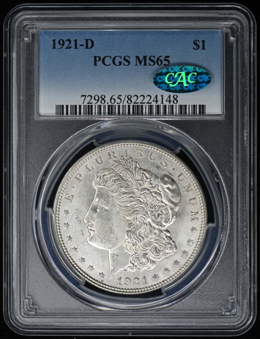 1921-D Morgan Dollar PCGS MS65 CAC Certified Uncirculated Coin: 1921-D Morgan Dollar PCGS MS65 CAC Certified Uncirculated Coin This 1921-D Morgan Dollar, graded MS65 by PCGS and carrying a CAC designation, is a stunning example of uncirculated coinage. Struck at t