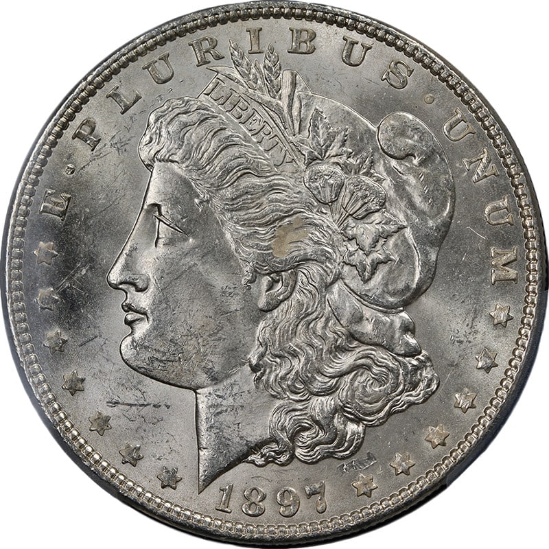 1897-P Morgan Silver Dollar PCGS MS63 Odd Strike Error: 1897-P Morgan Silver Dollar PCGS MS63 Odd Strike Error This 1897-P Morgan Silver Dollar is certified by PCGS with a grade of MS63, representing an uncirculated coin known for its appealing luster and