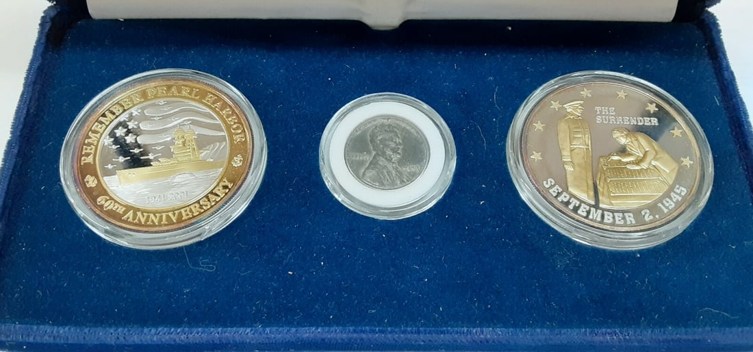 Three-Piece Pearl Harbor 60th Anniversary Silver Set With COA and Steel Cent: Three-Piece Pearl Harbor 60th Anniversary Silver Set With COA and Steel Cent This 60th Anniversary of Pearl Harbor commemorative set includes two 1 troy ounce silver medals and a 1943 steel cent. The