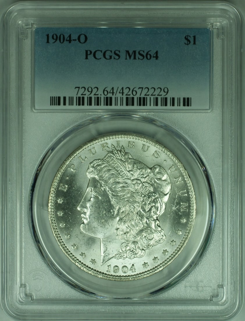PCGS MS-64 1904-O Morgan Dollar Silver Coin New Orleans Mint: PCGS MS-64 1904-O Morgan Dollar Silver Coin New Orleans Mint This is a 1904-O Morgan Silver Dollar coin graded MS-64 by PCGS. Minted in New Orleans, this uncirculated coin is composed of 90% silver an