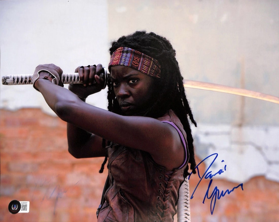 Danai Gurira Signed Michonne Walking Dead 11x14 Photo Beckett Certified: Danai Gurira Signed Michonne Walking Dead 11x14 Photo Beckett Certified This 11x14 photograph features Danai Gurira, renowned for her role as "Michonne" in the acclaimed series The Walking Dead. The p