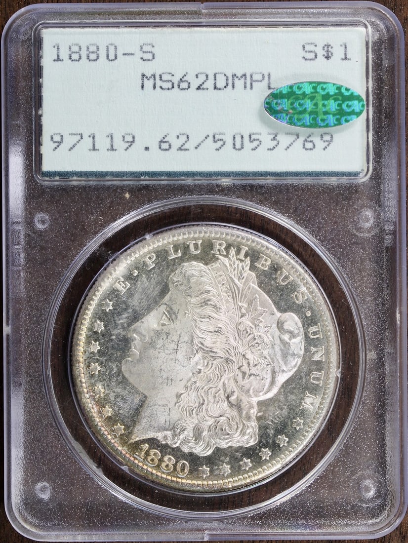 1880-S Morgan Silver Dollar MS62 DMPL CAC PCGS Rattler Deep Mirror: 1880-S Morgan Silver Dollar MS62 DMPL CAC PCGS Rattler Deep Mirror This 1880-S Morgan Silver Dollar is a stunning piece of numismatic history. Graded MS62 by PCGS, it exhibits deep mirrors that enhanc