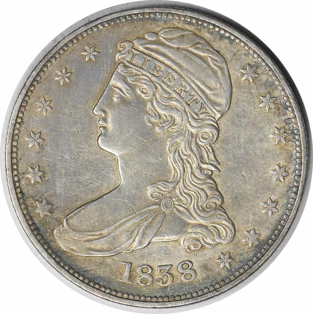 1838 Bust Silver Half Dollar Reeded Edge AU Uncertified: 1838 Bust Silver Half Dollar Reeded Edge AU Uncertified This 1838 Bust Silver Half Dollar is a remarkable collectible coin featuring a reeded edge and designed by Christian Gobrecht. Struck in Philade