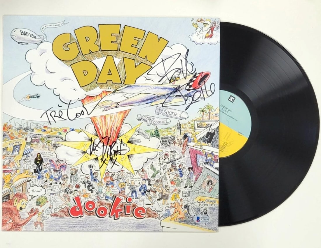 Green Day Signed Dookie Vinyl Cover Beckett Authenticated 3 Autographs: Green Day Signed Dookie Vinyl Cover Beckett Authenticated 3 Autographs This collectible features a Green Day Dookie vinyl cover, uniquely signed by three band members: Billie Joe Armstrong, Tre Cool,