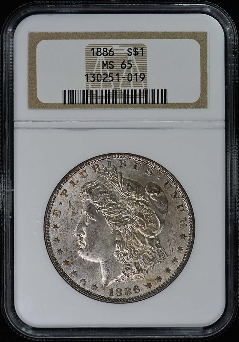1886 NGC MS65 Uncirculated Morgan Silver Dollar Coin: 1886 NGC MS65 Uncirculated Morgan Silver Dollar Coin This 1886 Morgan Dollar, graded MS65 by NGC, is a stunning uncirculated coin from the Philadelphia mint. With its rich history and exceptional cond