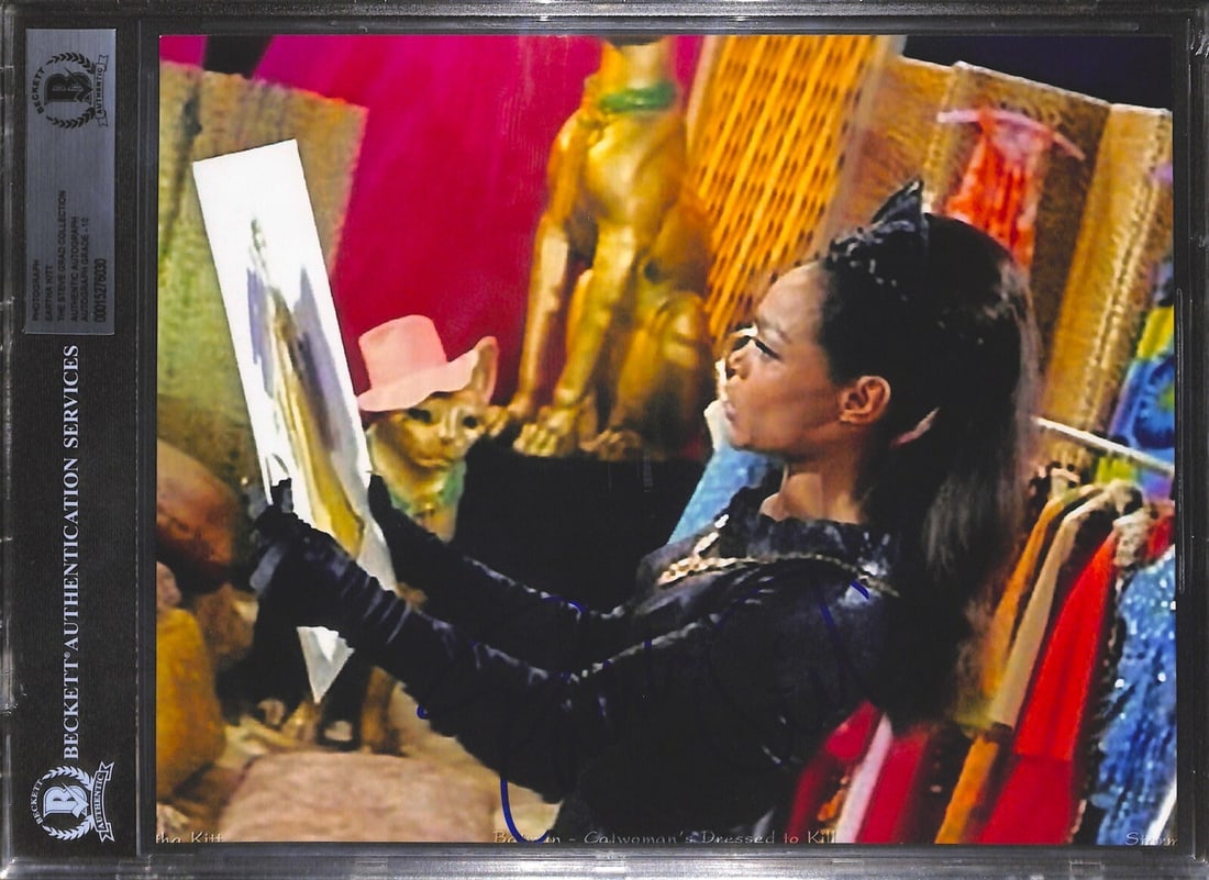 Signed 8x10 Photograph of Eartha Kitt as Catwoman Authenticated by Beckett: Signed 8x10 Photograph of Eartha Kitt as Catwoman Authenticated by Beckett This 8x10 inch color photograph features Eartha Kitt as Catwoman from the Batman TV series. The photo has been hand-signed in