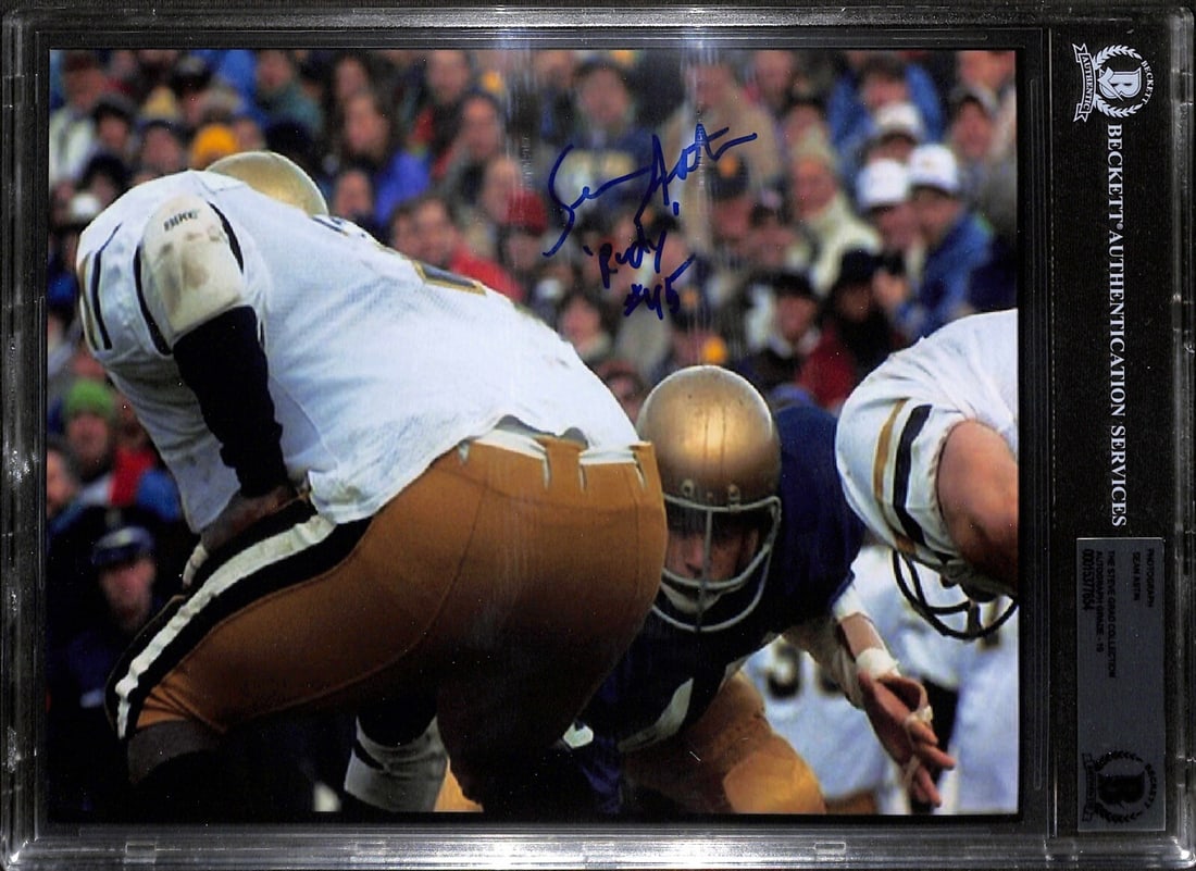 Sean Astin Signed 8x10 Rudy Photo Auto Grade 10 Beckett: Sean Astin Signed 8x10 Rudy Photo Auto Grade 10 Beckett This is an autographed 8x10 color photograph of Sean Astin, best known for his role in the film "Rudy." The photograph features an inscription t
