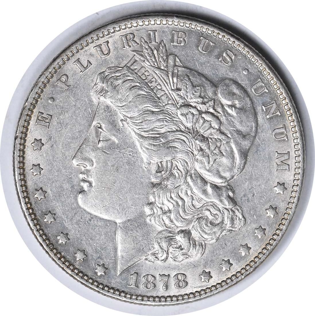 1878 Morgan Silver Dollar Triple Blossom AU Uncertified 90% Silver: 1878 Morgan Silver Dollar Triple Blossom AU Uncertified 90% Silver This 1878 Morgan Silver Dollar showcases the classic design by George T. Morgan and is a notable addition for any coin collector. The