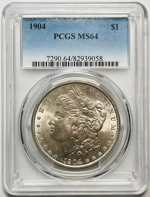 PCGS MS64 1904 Silver Dollar from Philadelphia Mint: PCGS MS64 1904 Silver Dollar from Philadelphia Mint This 1904 Morgan Silver Dollar is certified by PCGS with a grade of MS 64. Struck in silver at the Philadelphia Mint, this uncirculated coin is a pr