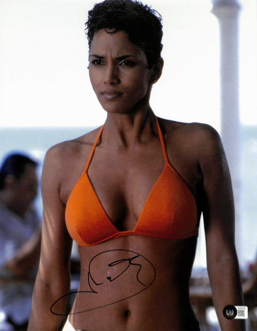 Halle Berry Autographed 11x14 Photo as Jinx in Die Another Day Beckett Authenticated: Halle Berry Autographed 11x14 Photo as Jinx in Die Another Day Beckett Authenticated This is an original 11x14 photograph signed by Halle Berry as Jinx from the James Bond film "Die Another Day." The