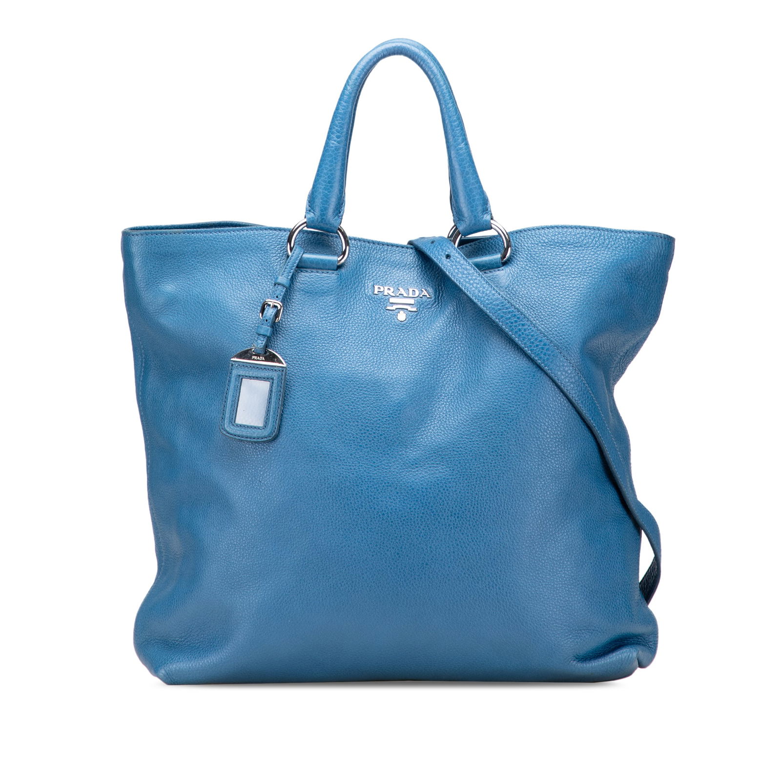 Prada Vitello Daino Blue Leather Convertible Tote Bag: Prada Vitello Daino Blue Leather Convertible Tote Bag The Prada Vitello Daino Open Convertible Tote is a stylish and versatile bag crafted from high-quality leather. This satchel features rolled leath