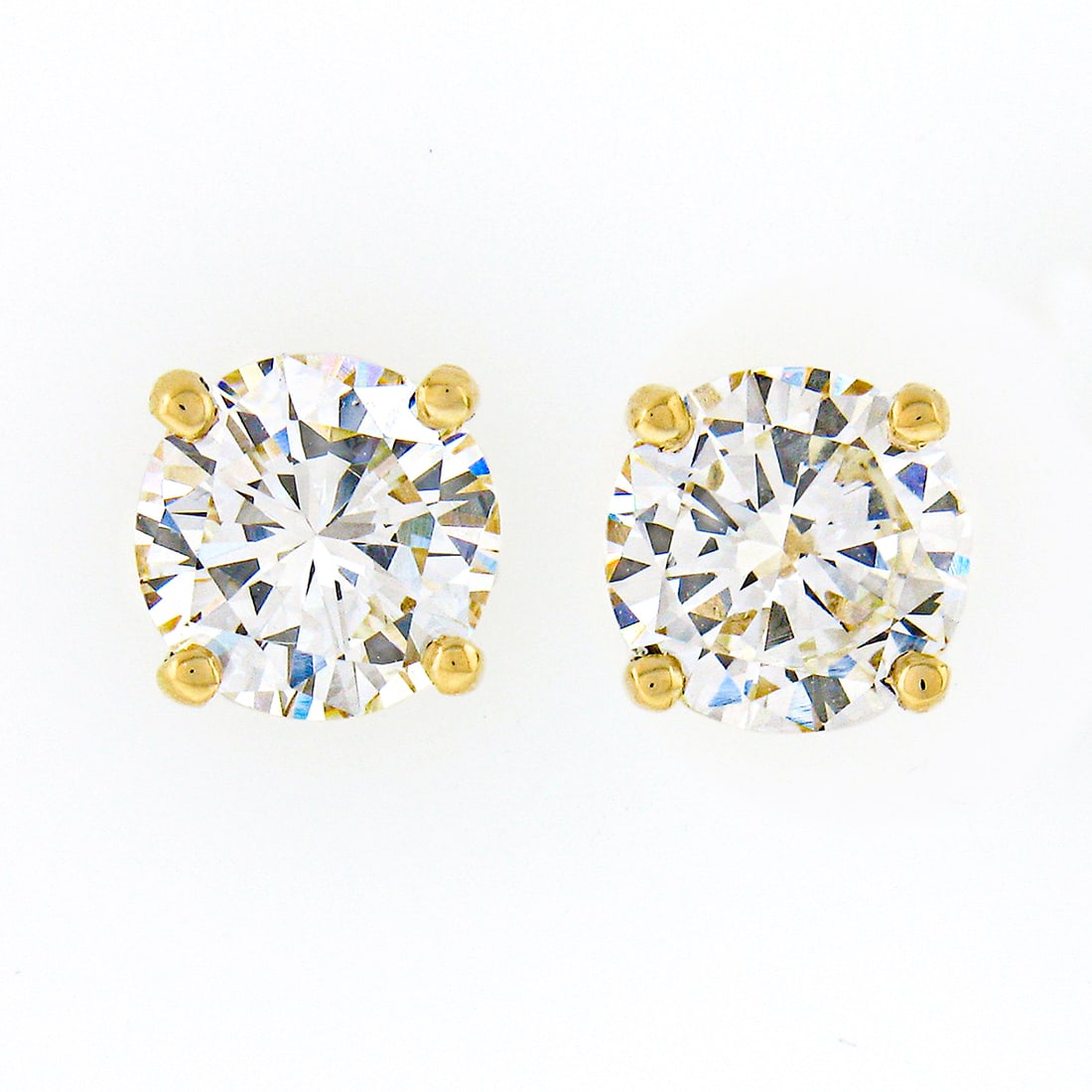 14k Yellow Gold 0.92ct Round Brilliant Diamond Stud Earrings: 14k Yellow Gold 0.92ct Round Brilliant Diamond Stud Earrings Elevate your elegance with these stunning classic stud earrings, expertly crafted in solid 14k yellow gold. Featuring two natural round bri
