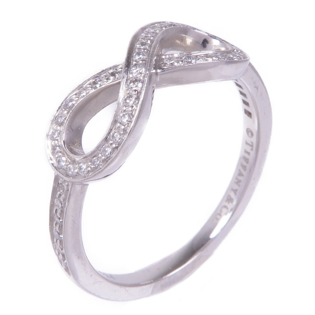 TIFFANY&CO Infinity Ring Diamond in PT950 Platinum Size 5.75: TIFFANY&CO Infinity Ring Diamond in PT950 Platinum Size 5.75 This exquisite Tiffany & Co. Infinity Ring features a stunning diamond set in premium Pt950 platinum, exuding elegance and sophistication.