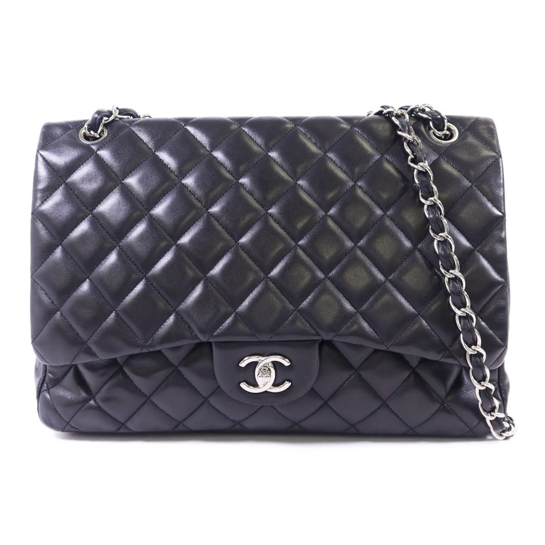Black Lambskin Chanel Maxi Classic A5860 Shoulder Bag with Silver Tone Chain: Black Lambskin Chanel Maxi Classic A5860 Shoulder Bag with Silver Tone Chain This Chanel Maxi Classic Chain Shoulder Bag features luxurious black lambskin leather and signature CC detailing. The bag i