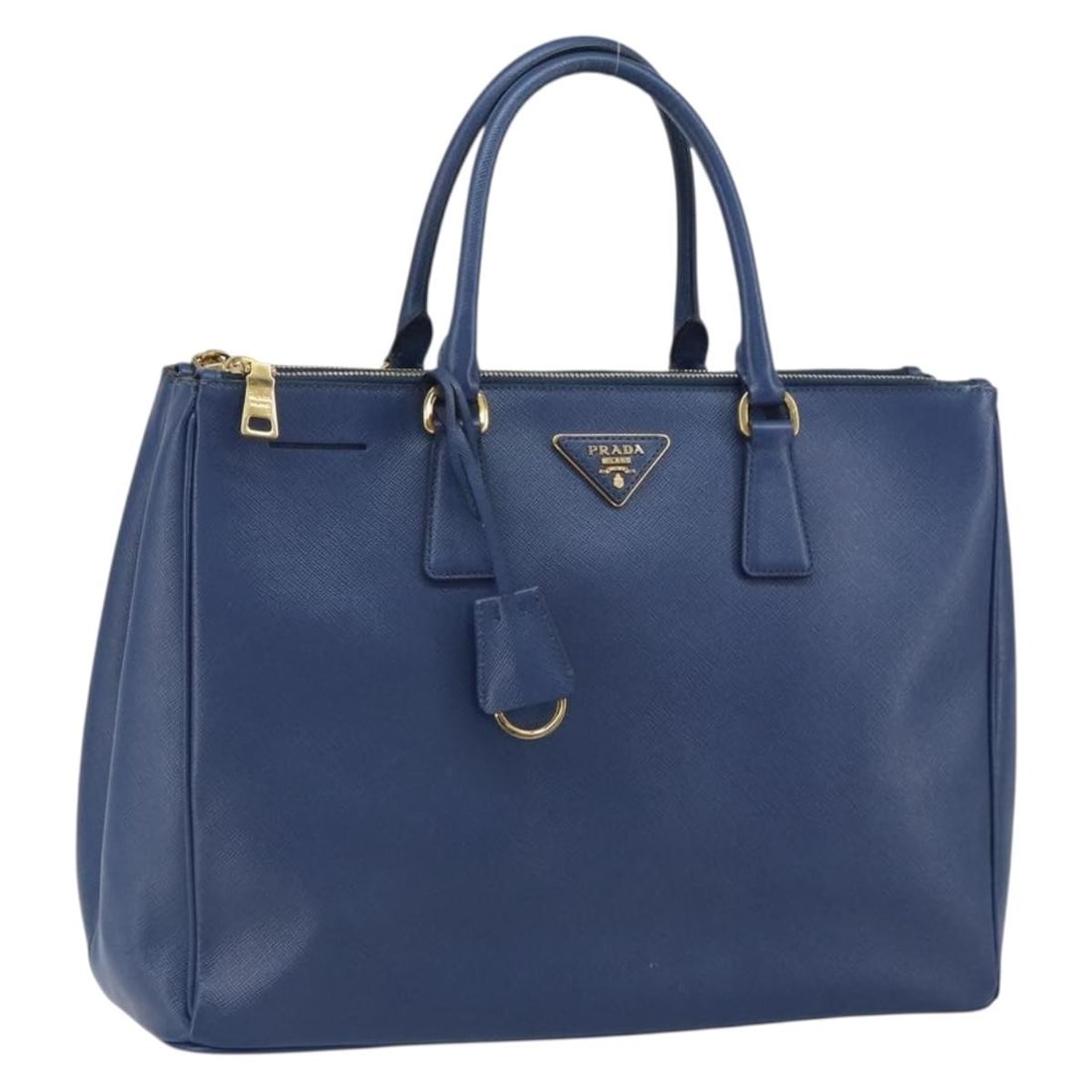 Blue and Gold Leather Prada Handbag from Italy: Blue and Gold Leather Prada Handbag from Italy This PRADA handbag is crafted from leather in a blue and gold color combination. Made in Italy, it features a structured silhouette with approximate dime
