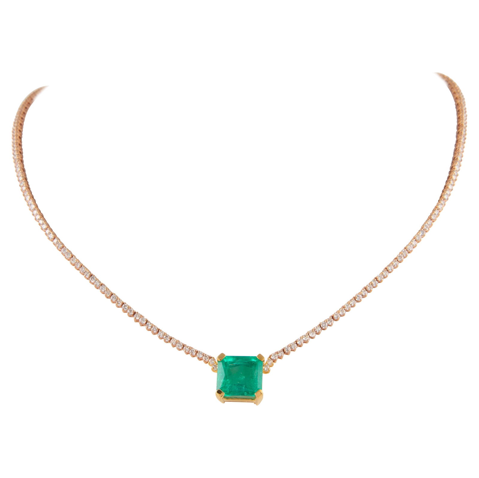 10.11ct Emerald Diamond Tennis Necklace 18k Gold: 10.11ct Emerald Diamond Tennis Necklace 18k Gold This stunning modern tennis necklace features a captivating 10.11ct Colombian emerald at its center, complemented by 236 round brilliant diamonds. The