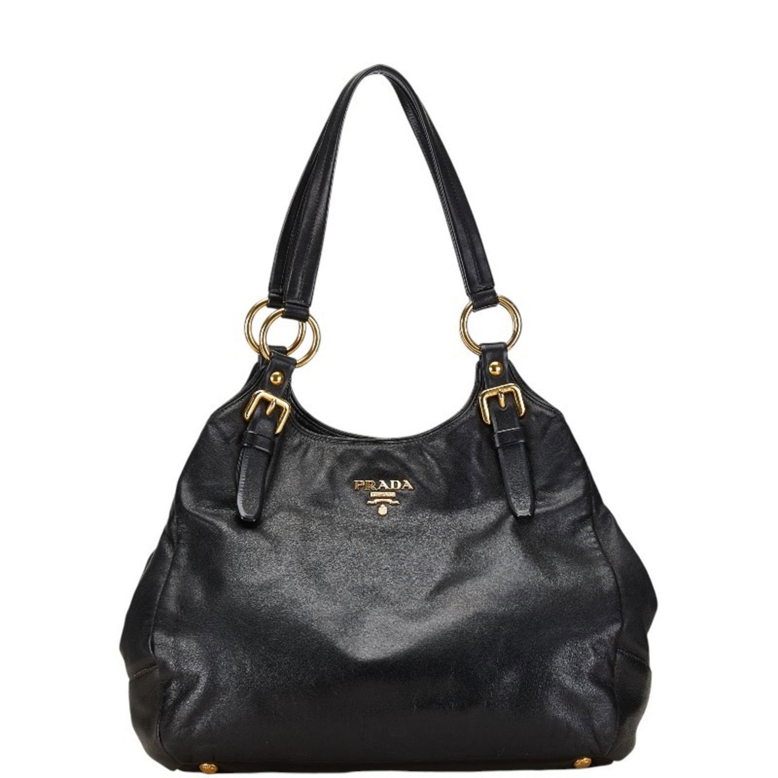 Black Leather Prada Vitello Handbag 25cm x 40cm x 16cm: Black Leather Prada Vitello Handbag 25cm x 40cm x 16cm This Prada Vitello handbag is crafted from black leather and features a spacious design. It is designed for women and made in Italy. The bag show