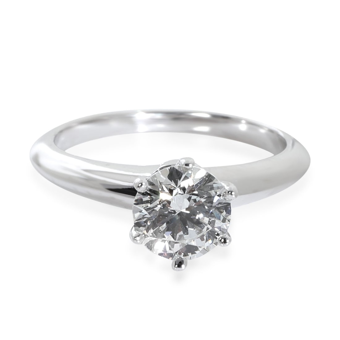 Tiffany & Co. 0.92 ct Round Diamond Engagement Ring Platinum: Tiffany & Co. 0.92 ct Round Diamond Engagement Ring Platinum This exquisite Tiffany & Co. engagement ring showcases a stunning round brilliant diamond weighing 0.92 carats, with a clarity grade of VS1
